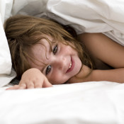 Kid in white bed